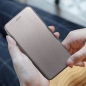 Preview: iPhone 12 mini Elegance Book Case grau in der Hand Zubehör online kaufen bestellen