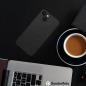 Preview: iPhone Silicone Mag Cover MagSafe in schwarz Details am Tisch Zubehör online kaufen bestellen